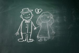 chalk drawing of wedding couple with wife rubbed out