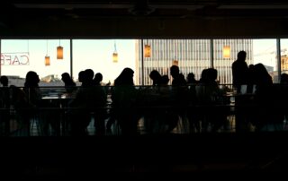 people in a busy cafe meeting up