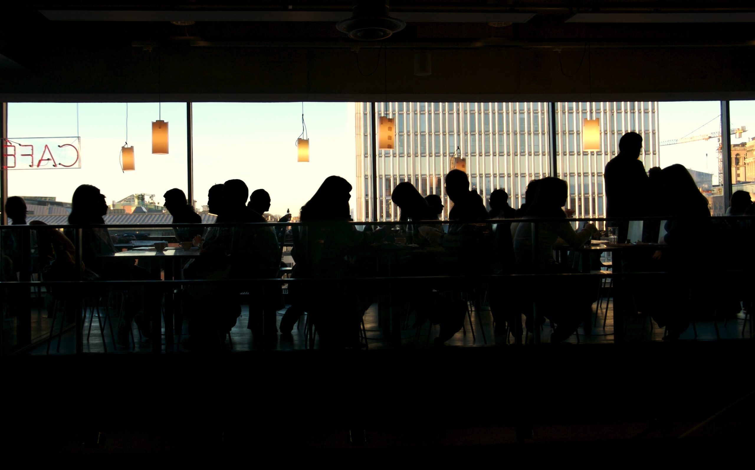 people in a busy cafe meeting up