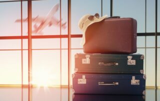 pile of suitcases at an airport