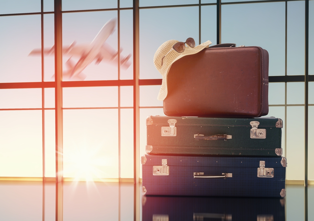 pile of suitcases at an airport