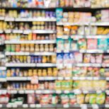 blurred branded food on supermarket shelf