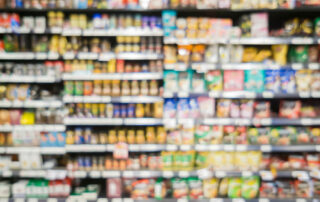 blurred branded food on supermarket shelf