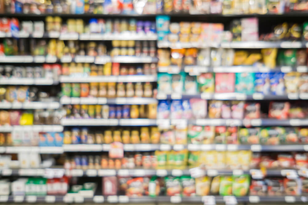 blurred branded food on supermarket shelf