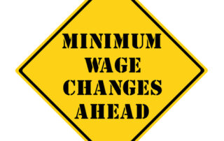 minimum wage changes ahead sign