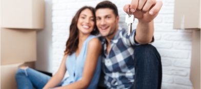 Young couple new homeowners with keys