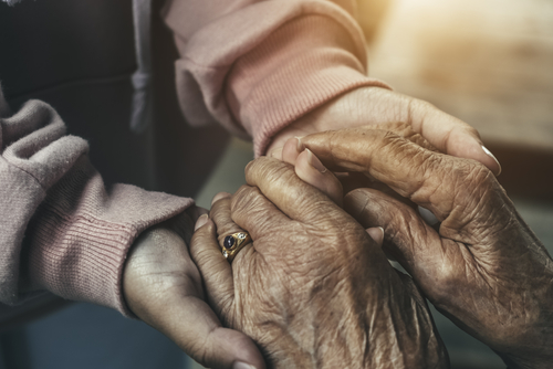 old and young hands holding