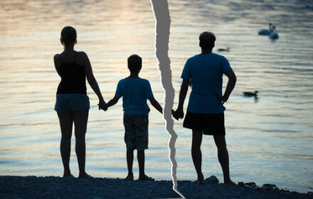 silhouette of separated couple with child