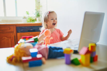 toddler in front of a laptop