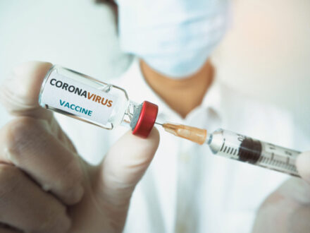 doctor preparing a Covid vaccine