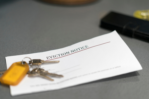 eviction notice paperwork with set of house keys