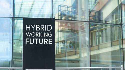 hybrid working future sign in front of an office