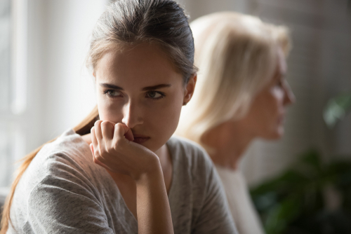 older adult disagreeing with parent