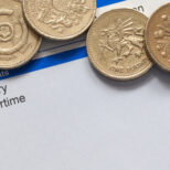 pay slip with pound coins