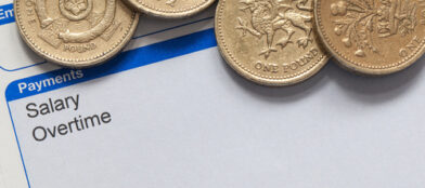 pay slip with pound coins