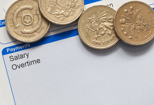 pay slip with pound coins